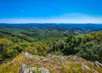 Breathtaking panoramic view of the Bükk Mountains captured from Három-kő, one of the most iconic lookout points in northern Hungary.