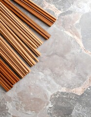 Natural display of bamboo incense sticks on a granite surface with earthy hues and texture