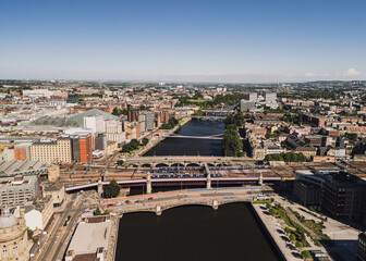 Glasgow Scotland: 18th May 2025: Bridges over the River Clyde on a sunny day. Trains cross Caledonian Railway Bridge near Central Station