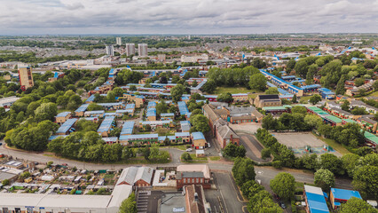 Newcastle upon Tyne UK: 24th May 2025: Aerial view of Byker. Drone footage. Colourful rooftops and lush greenery dominate the landscape. The view reveals a bustling residential area