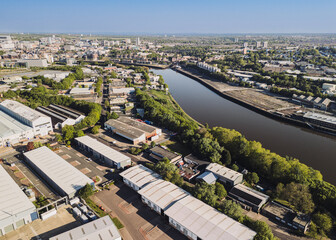 Gateshead UK: 10th May 2025: Overview of East Gateshead Industrial Estate showcasing commercial and residential areas on the River Tyne