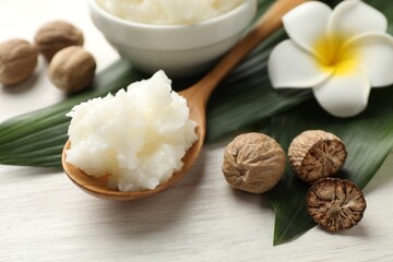 Natural shea butter on white wooden table, closeup
