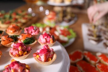 Buffet menu. Tasty stuffed tartlets on stand, closeup