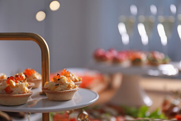 Buffet menu. Tasty stuffed tartlets on stand, closeup