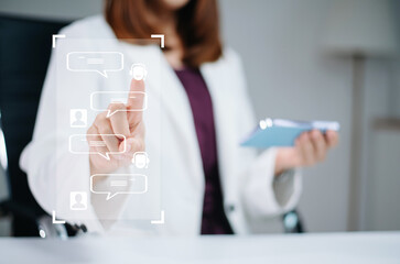 Businesswoman uses touchscreen interface with AI chatbot icons. Concept of digital support,...