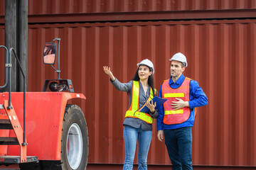 Logistics Managers Overseeing Container Yard Operations, Female Supervisor and Male Worker at Shipping Port, Industrial Team Discussing Freight Operations by Forklift
