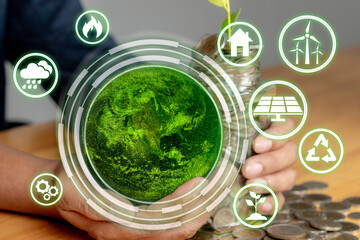 Close-up of male hand saving coins in jar beside green globe, symbolizing eco-conscious financial habits.
