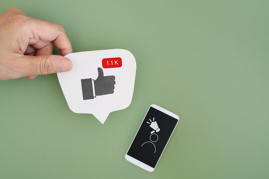thumb up, like sign with number in red rectangle with white smart phone and , UGC icon, User-generated content , on green background - Powered by Adobe