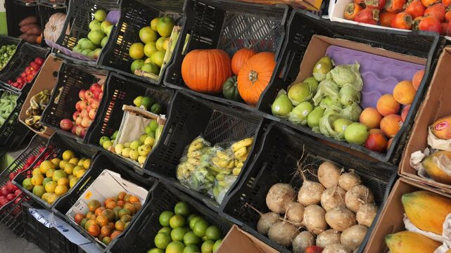 Fruits on display in crates at Mexican food market or Mexican neighborhood shop.