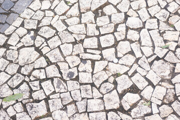 Texture of a street pavement with square and rectangular stones. Geometric pattern. Background....