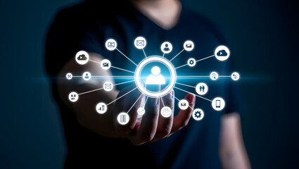 Person interacting with a digital network of communication and data icons connected to a central user profile