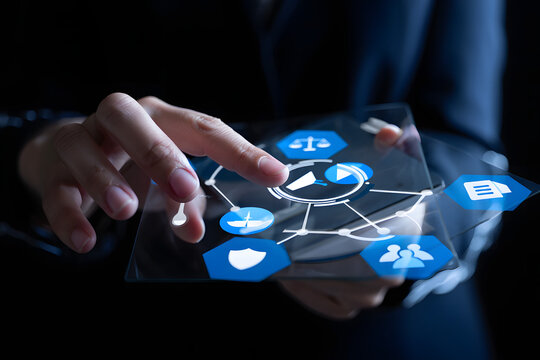 Hand interacting with a futuristic holographic interface displaying various digital icons and data connections