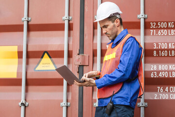 Port Worker Checking Cargo Information on Tablet, Logistics Professional Verifying Container Specifications, Warehouse Employee with Hard Hat and Tablet Next to Shipping Container