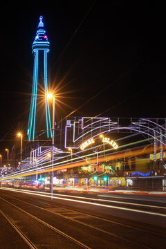 Blackpool Tower night view with Coral Island lights and traffic trails