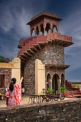 Beautiful combination of Mughal & Rajputana Architecture carved in Stone with young woman in...