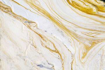 A background of white and yellow foam on the surface of the water. Texture backgrounds for wallpaper design graphics.