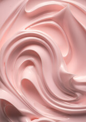 A close-up view of a creamy, textured surface with soft, flowing swirls and peaks. The dominant color is a pastel pink, creating a soothing and delicate appearance. 