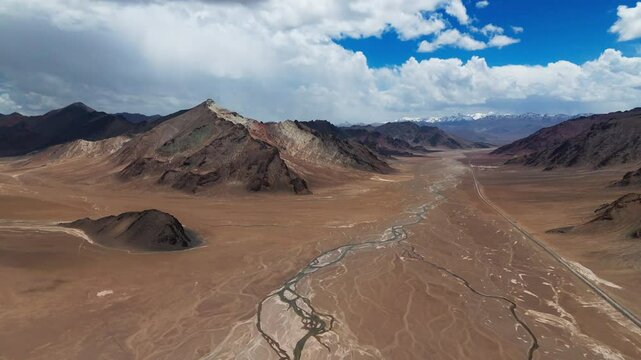 Aerial of Central Asia Pamir Highway adventure off road travel in Tajikistan mountains range scenic landscape