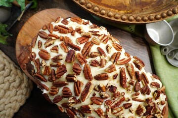 Baking a carrot cake loaf with cream cheese icing and topped with roasted salted pecans.  Making a...