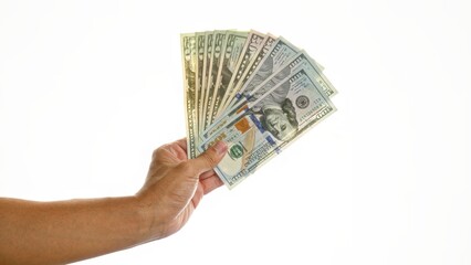 Hand holding several american dollar bills isolated over a white background, showcasing united...