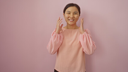 Woman smiling against a vibrant pink background, showcasing fashion style, confidence, and elegance...