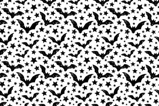 Seamless vector halloween pattern with silhouettes of bats and stars on a white background. Traced