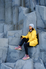 Exploring Reynisfjara Beach with dramatic basalt columns in Iceland