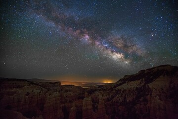 The Milky Way glows above the canyon