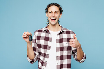 Young man he wears purple checkered shirt casual clothes hold in hand car key fob keyless system...