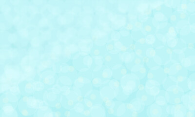 淡い水色にとけ込んだ白い水玉模様の背景