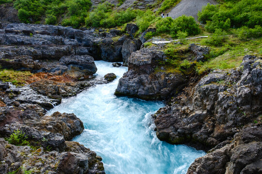 Discover stunning Barnafoss and Hraunfossar waterfalls amid Icelands rugged beauty