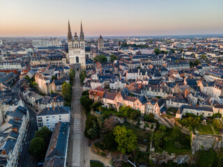 Obraz premium Aerial shot of stairs leading up to cathedral of Saint Maurice in Angers at sunrise