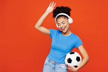 Young woman fan wearing basic blue t-shirt cheer up support football sport team hold in hand soccer...