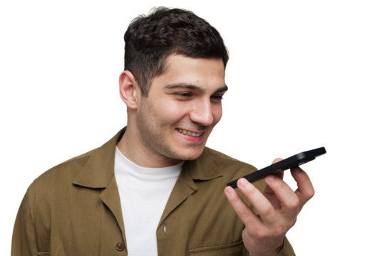 Smiling young man engaged in a cheerful conversation while holding a smartphone