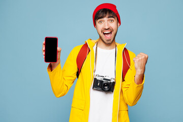 Traveler winner man in yellow casual clothes hold use blank screen mobile cell phone isolated on...