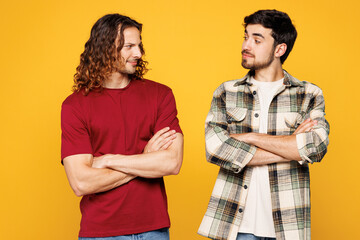 Young two friends buddies men they wearing casual clothes together hold hands crossed folded...