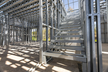 Fire exit stair of large factory building. Galvanise metal stair step. Metal frame of the stairs....