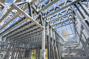 New technology steel frame for construction. Metal frame of the building with a sandwich panel of...