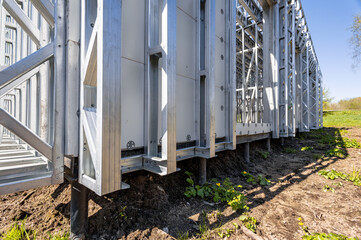 Pile foundation. Pile support of an apartment building. Modern frame house on stilts. The...