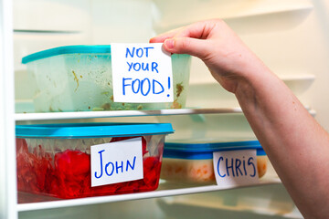 Dramatic and angry stickers on meal prep containers in work fridge. Great for office themed social...