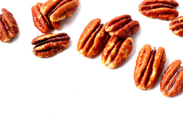 Delicious salted pecan nuts scattered.
