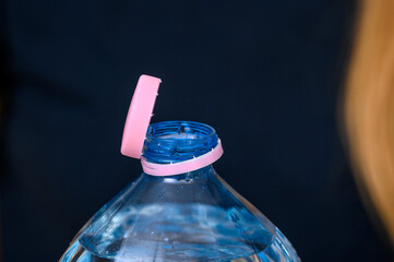 Close-up of the cap attached to a plastic returnable deposit bottle
