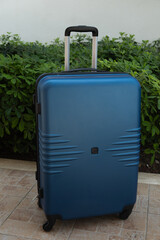 Travel suitcase outdoors. Tourism and summer vacation concept.