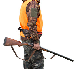 Pheasant hunters with shotgun walking through a meadow.