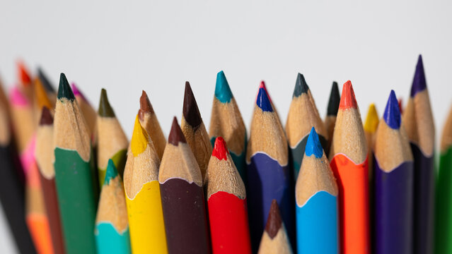 A collection of colorful pencils stands upright, showcasing their tips in various shades. Ideal for students preparing for back to school art and craft projects, inspiring creativity and imagination.