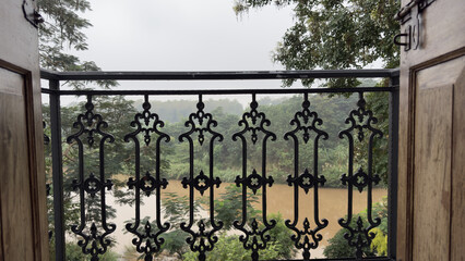 Vintage Iron Balcony Railing with River and Forest View