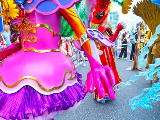 Cropped view of a vibrant carnival parade fragment in Nha Trang, Vietnam. Bright thematic costumes...