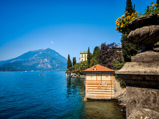 Naklejka premium Lush Botanical Garden of Villa Monastero Overlooking Lake Como: Elegant Historic Estate Surrounded by Mediterranean Flora and Alpine Scenery