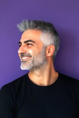 Fototapeta premium Visual layout art of style for aging men. Purple solid background. Classy men's spiky hair haircut - midlife middle eastern man with short hair. A handsome man with a captivating smile.