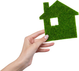 Female hands hold a model of a green house close-up. Sale of ecological real estate of the future.